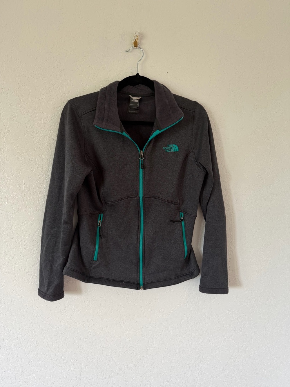 The North Face Women’s Dark Gray Fleece Jacket with Teal Trim